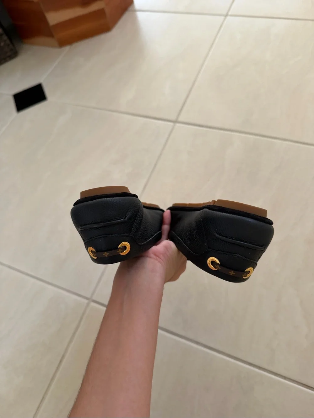 Louis Vuitton Black Leather Loafers with Gold Accent Hardware